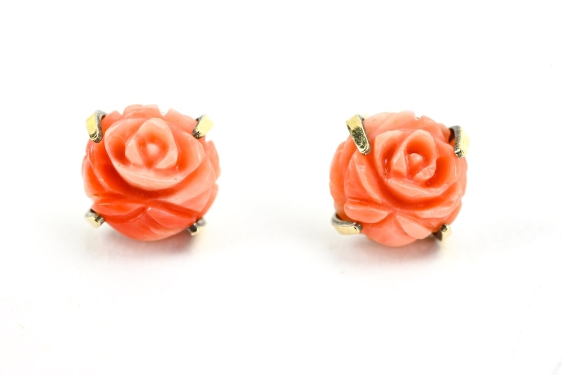 Estate Pair of Hand Carved Coral Flower Earrings: Estate Pair of Hand Carved Coral Flower Stud Earrings. Each measures just over .25 of an inch in diameter.