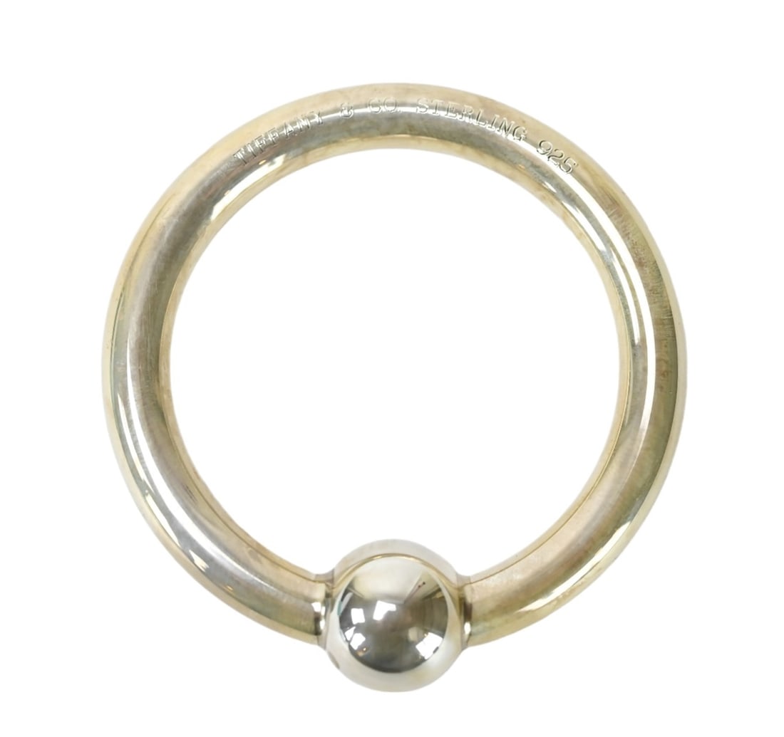 Tiffany & Co Sterling Silver Baby Rattle in Box: Tiffany & Co Sterling Silver Baby Rattle in Tiffany Bag and Box. Measures 2.5 inches in diameter.