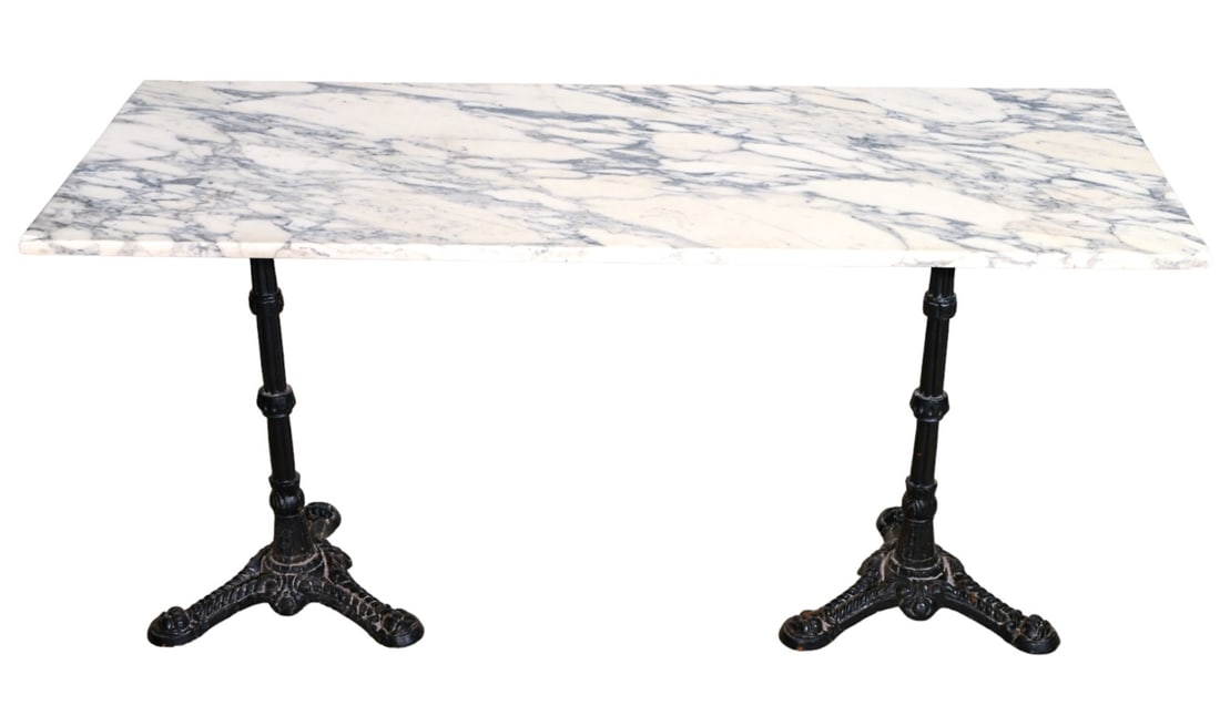 French Bistro Marble & Wrought Iron Pedestal Table: French Bistro Marble & Wrought Iron Pedestal Table.Measures 29 inches x 60 inches x 24 inches.Chip on two corners