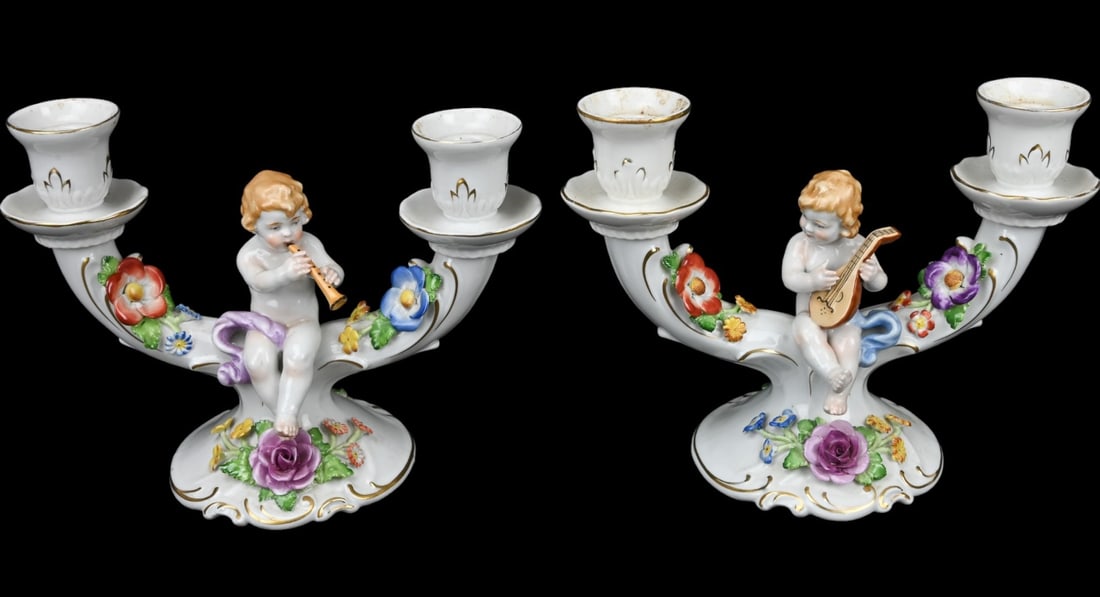 Schierholz Porcelain Capodimonte Style Candelabras: Vintage Schierholz Porcelain Hand Painted Capodimonte Style Candelabras Featuring Putti Playing Instruments. Each measures 7 inches x 9 inches.