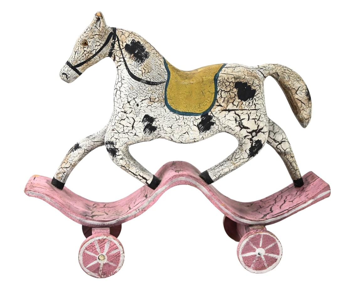 Huebbe Signed Carved Rocking Horse on Wheels: Huebbe Signed Carved and Hand Painted Rocking Horse on Wheels Table Top Statue. Measures 13 inches x 15 inches x 5 inches.