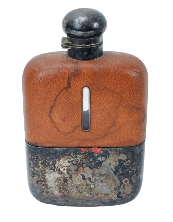 Antique Silver Plated and Leather Brandy Flask: Antique Silver Plated and Leather Brandy Flask.Measures 8.5 inches x 5 inches x 2.5 inches.