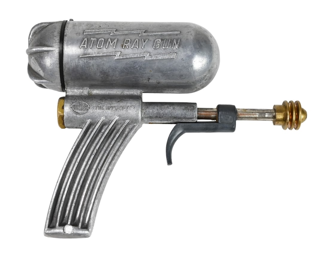 Stanley Hillar Atomic Ray Gun Water Gun: Stanley Hiller Atomic Ray Gun Water Gun by Hiller Mfg.USA c. 1948, of Cast Aluminum and Brass. Measures 4 inches ? 6 inches.result: $3,780