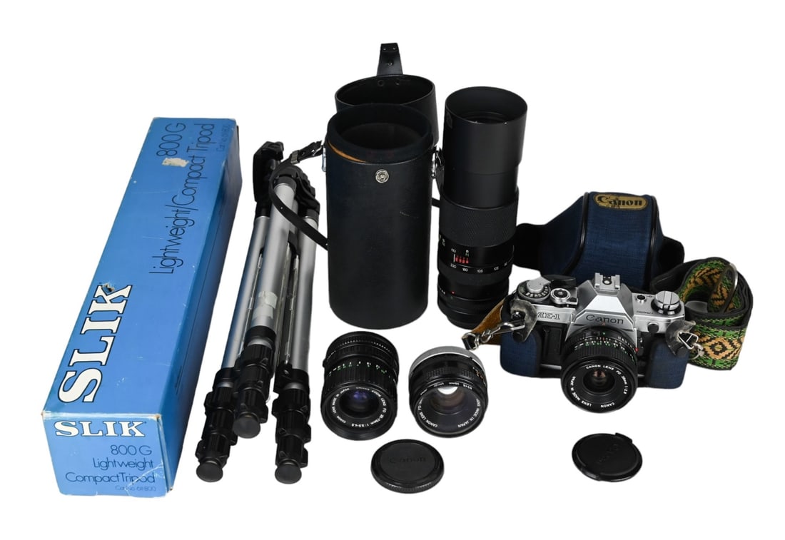 Vintage Canon AE-I Film Camera w Lenses & Tri Pod: Vintage Canon AE-I Film Camera w Lenses & Tri Pod. Camera measures 6 inches x 4 inches.