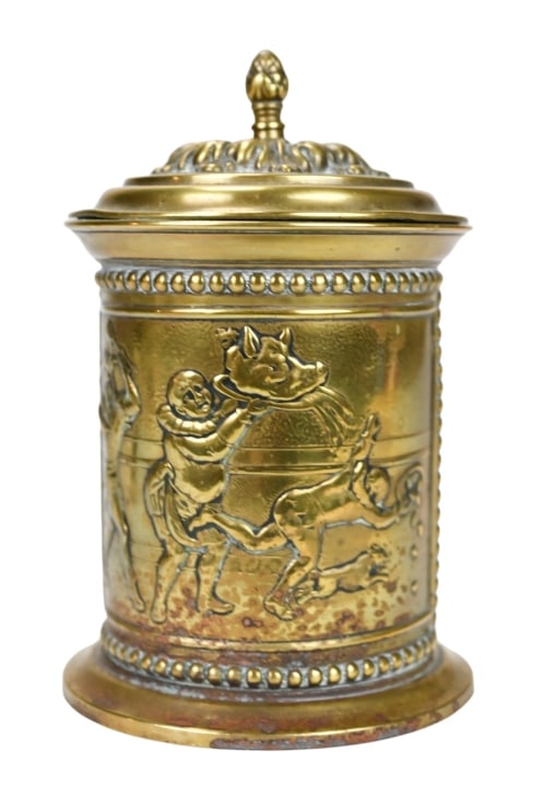 Antique English Reposse Brass Tabacco Jar: Antique English Reposse Brass Tabacco Jar with Cover Featuring Jester and Boar Motif with Steel Lining. Measures 7 inches x 4 inches in diameter.