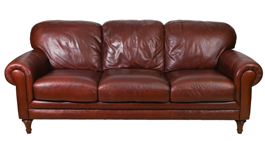 Mid Century Burgundy Leather Upholstered Sofa: Mid Century Burgundy Leather Upholstered Sofa.Measures 36 inches x 88 inches x 38 inches, seat height 21 inches.