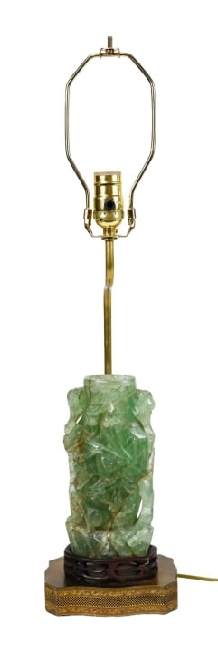 Antique Carved Jade Table Lamp w Internal Light: Antique Carved Jade Table Lamp w Internal Light Carved Stand on Pierced Brass Base. Lamp is electric, Internal light illuminates the carving from the inside. Measures 25 inches x 6 inches x 4 inches.
