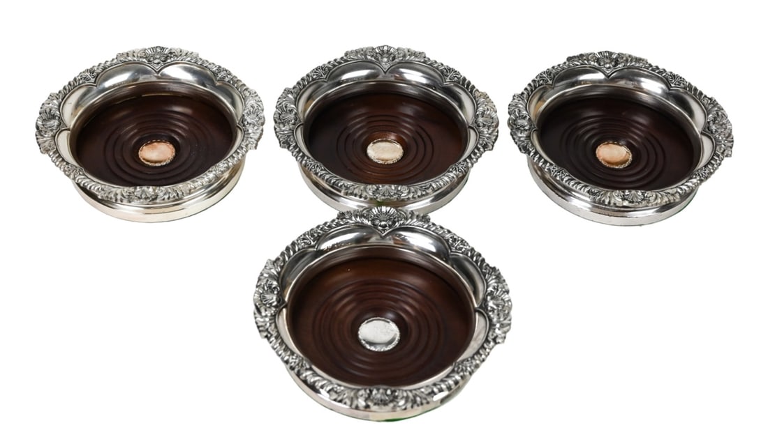 4 Vintage English Silver Plate Wine Coasters: 4 Vintage English Silver Plate Wine Coasters. Die Stamp molded lip with acanthus leaf and shell motif. Turned wood interior with green Felt bottom and hallmark to the edge of the base