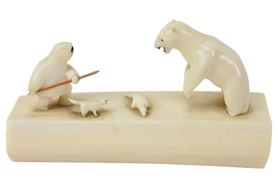 Inuit Carved Scrimshaw Alaskan Eskimo and Bear: Inuit Carved Scrimshaw Alaskan Eskimo and Bear Sculpture.Measures 3 inches x 5.5 inches x 2 inches.