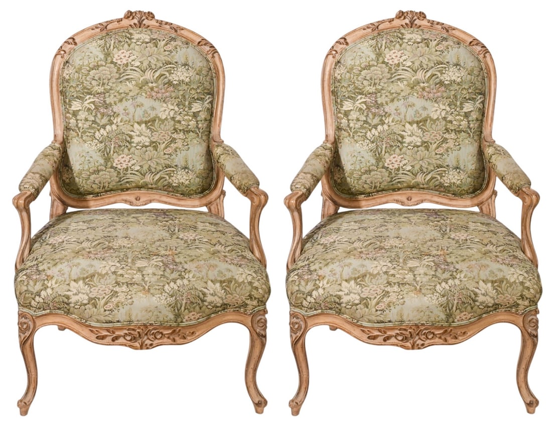 Pair August Studios Carved Upholstered Arm Chairs: Pair August Studios Carved Upholstered Armchairs.Measures 39 inches x 27 inches x 22 inches, seat height 17 inches.