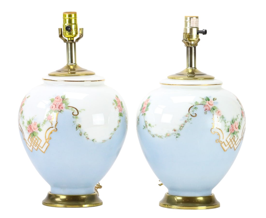 Pair of Hand Painted Porcelain Floral Design Lamps: Pair of Hand Painted Porcelain Floral Design Lamps.Measures 19 inches x 10 inches diameter.