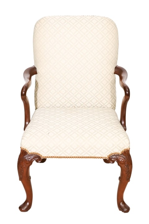 Queen Anne Style Carved Upholstered Armchair: Queen Anne Style Carved Upholstered Armchair with Nail Head Trim.Measures 40 inches x 25 inches x 23 inches, seat height 18 inches.