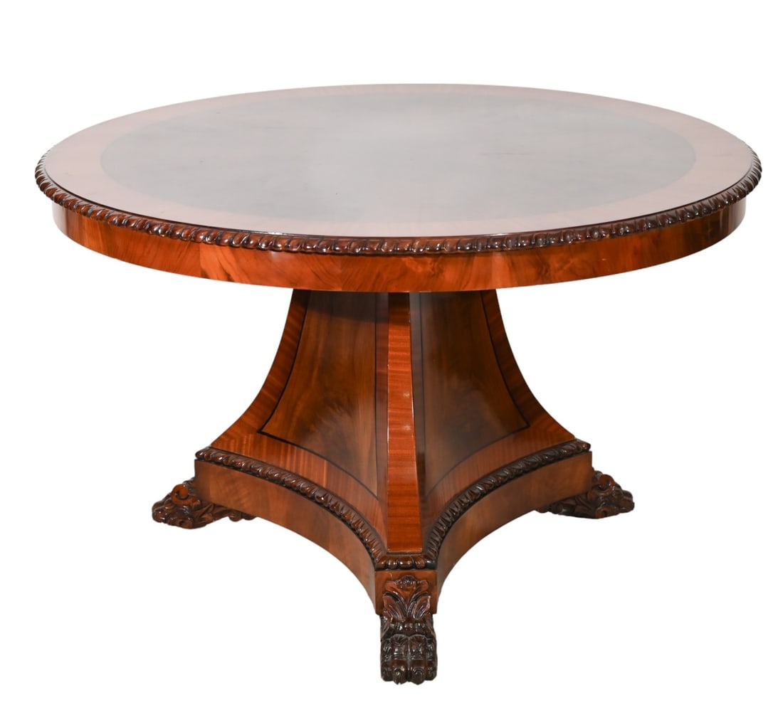 Empire Carved Round Pedestal Dining Table: Empire Hand Carved Cross Banded Flamed Mahogany Round Pedestal Dining Table. Measures 30 inches x 47 inches x 47 inches.