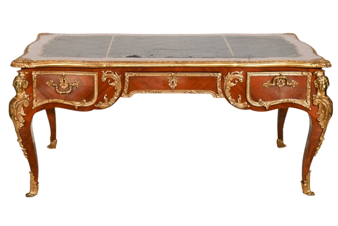 Late 19th C. Louis XV Style Gilt Bronze Bureau: Late 19th Century Louis XV Style Hand Carved Gilt Bronze Leather Top Bureau Plat Desk. Needs total repair. Missing veneer and loss to leather top. Sold as is. Measures 31 inches x 68 inches x 38 inche