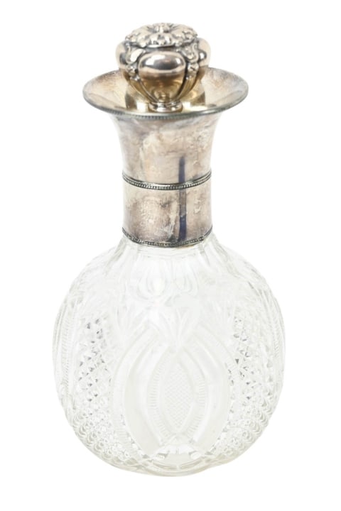 Antique 19 C Brilliant Cut Glass & Silver Decanter: Antique 19th Century Brilliant Cut Glass & Sterling Silver Decanter with Stopper. Measures 10 inches x 5 inches. Bottle is not hallmarked.