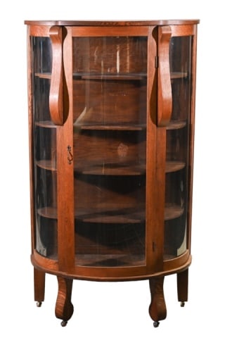 Antique Victorian Carved Curved Curio Cabinet: Antique Victorian Hand Carved Curved Curio Cabinet. Front panel is plastic.Measures 63 inches x 36 inches x 15 inches.