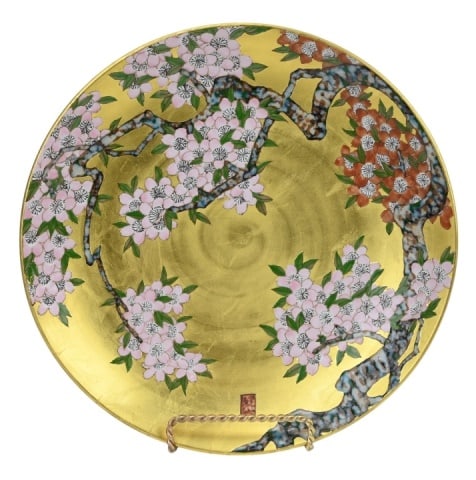 Japanese Arita Ware Traditional Decorative Plate: Japanese Arita Ware Traditional Hand Painted with Kinrande Porcelain Decorative Plate with Stand. Measures 15.5 inches diameter.