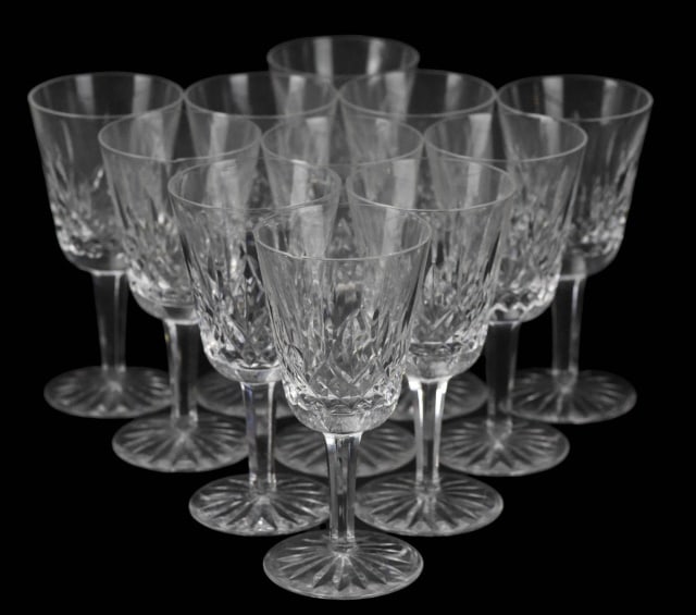 11 Waterford Crystal Lismore Wine Glasses: 11 Waterford Crystal Lismore Wine Glasses. One with small chip. Measures 5.5 inches x 2.75 inches.