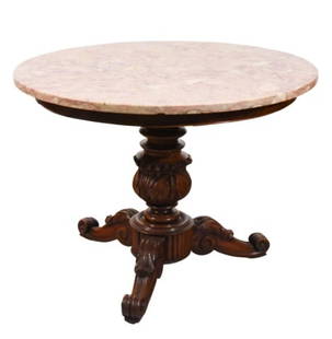 Antique Hand Carved Marble Top Cocktail Table: Antique Hand Carved Marble Top Cocktail Table on Casters. Marble has minor chips to underneath edge, missing a small trim.Measures 27 inches x 35 inches diameter.