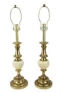 Pair Stiffel Brass & Ceramic Table Lamps: Pair Stiffel Brass & Ceramic Table Lamps. Ceramic glaze on each lamp is a slightly different off white. Sold as is. Each measures 30 inches x 7 inches.