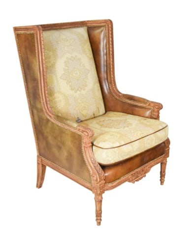 Louis XVI Style Leather Wingback Chair: Louis XVI Style Leather Wingback Chair with Hand Carved Frame. Back cushion and seat cushion needs to be Reupholstered. Sold as is.Measures 49 inches x 31 inches x 31 inches seat height 22 inches