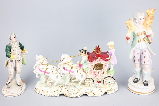 Vintage Capodimonte Statues Horse Drawn Carriage: Vintage Capodimonte Style Horse Drawn Carriage and Riders Statue, and 2 Figural Statues. Statues are unsigned, 2 note manufacture in Japan. Carriage measures 8 inches x 12 inches x 5 inches.