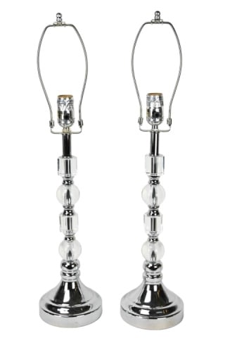 2 Stacked Glass Column Form Table Lamps & Shades: Pair Stacked Glass and Chrome Tone Column Form Table Lamps & Shades. Each measures 26 inches including harp and finial, shades are 10 inches x 16 inches x 11 inches.