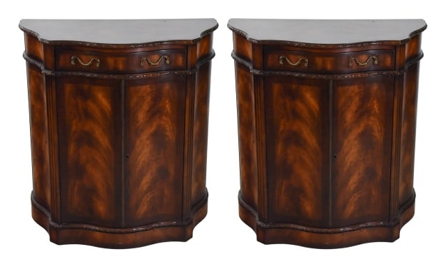 Pair Carved Mahogany Demi Lune Serpentine Cabinet: Pair Hand Carved Flame Mahogany Demi Lune Serpentine Cabinet.Measures 34 inches x 32 inches x 16 inches.