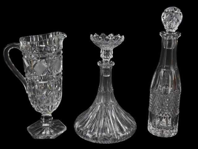3 American Brilliant Cut Glass Carafes & Pitcher: 3 American Brilliant Cut Glass Carafes & Pitcher. Larger measures 14 inches x 4 inches.