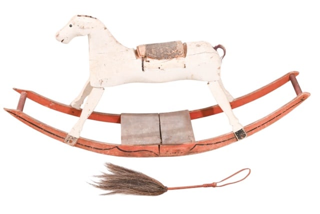 Antique Victorian Carved Ride On Rocking Horse: Antique Victorian Hand Carved and Hand Painted Ride On Rocking Horse. Original horse hair main is missing, part of horse hair tail is still present. Original saddle has substantial wear. There is leat