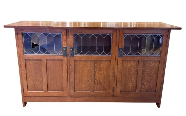 Stickley Three Door Display Buffet w/ Art Glass: Stickley Three Door Display Buffet with Art Glass Panel. Needs repair and refinishing. Top left corner glass broken.Measures 42.5 inches x 78 inches x 19.5 inches.