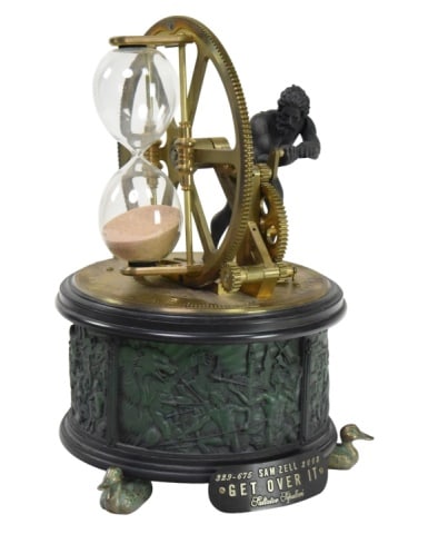 Sam Zell "Get Over It" Automation Musical Box: Sam Zell "Get Over It" 2002 Automation Musical Box Limited Edition 329-675. There is a rechargeable battery but no cord.Measures 14 inches x 9 inches in diameter.
