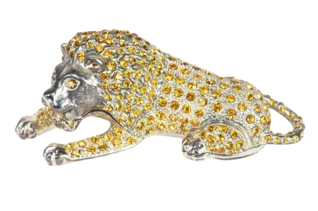 Godinger Silver Art Co. Lion Trinket Box: Godinger Silver Art Co. Silver Plated Lion Trinket Box with Yellow Rhinestones. Measures 1.5 inches x 4.5 inches.