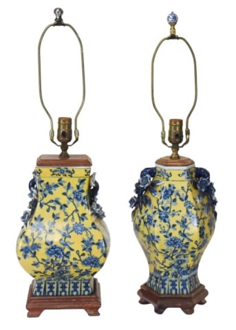Two Chinese Blue & Yellow Porcelain Table Lamps: Two Chinese Blue and Yellow Porcelain Table Lamps on Carved Wood Base.Largest lamp measures 19 inches x 8.5 inches x 6.5 inches.