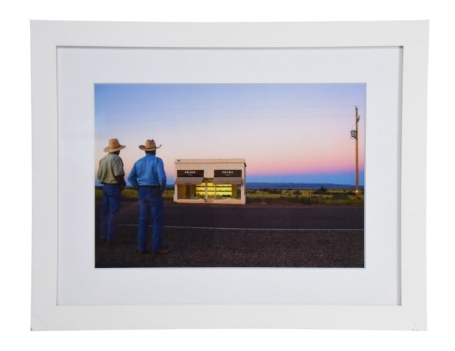 Gray Malin "Two Cowboys, Prada Marfa" Photograph: Gray Malin "Two Cowboys, Prada Marfa" Framed Fine Art Photograph. It features two figures gazing at a designer boutique in the Texas desert, printed on archival luster paper.Measures 20 inches x 25.25