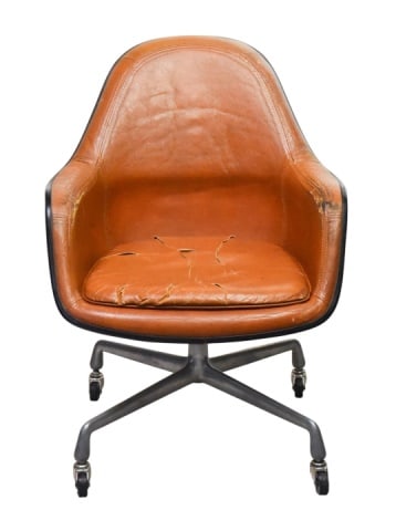 Vintage Orange Herman Miller Leather Chair: Vintage Orange Herman Miller Leather OfficeChair Designed by Charles and Ray Eames in 1975.Measures 34 inches x 26 inches x 20 inches x 18 inches.Notable wear and tearing on seat cushion, chair needs 