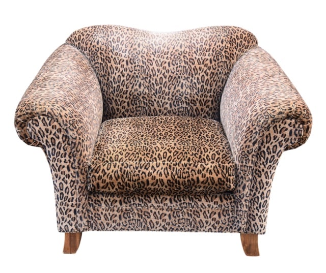 Oversized Upholstered Leopard Print Armchair: Oversized Rounded Custom Upholstered Leopard Print Armchair.Measures 35 inches x 48 inches x 37 inches x 19 inches. Please note that the top backrest fabric is worn. Item could use reupholstering. Sol
