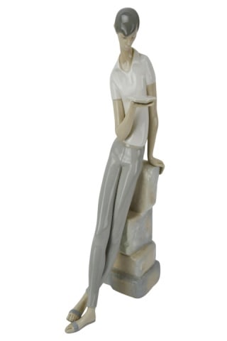 Lladro Porcelain Man with Book Figurine: Lladro Porcelain Man with Book Figurine. Measures 18 inches x 9 inches.