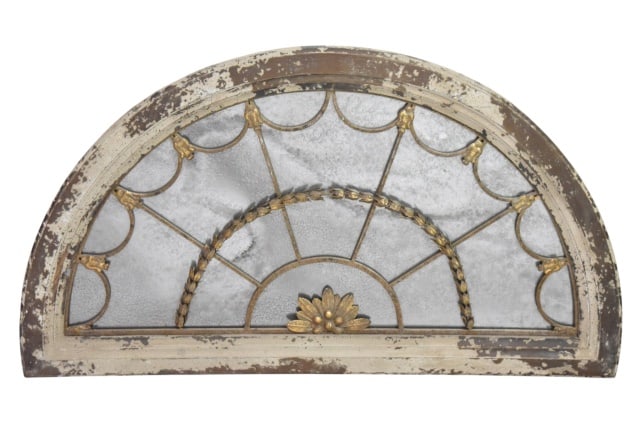 French Arch Transom Window w/ Aged Glass Mirror: French Arch Transom Window w/ Aged Glass Mirror. Item is made of wood, glass and gilt painted tole. Weathered finish and wall mounting brackets on the back. Measures 25.5 inches x 44.5 inches 1.5