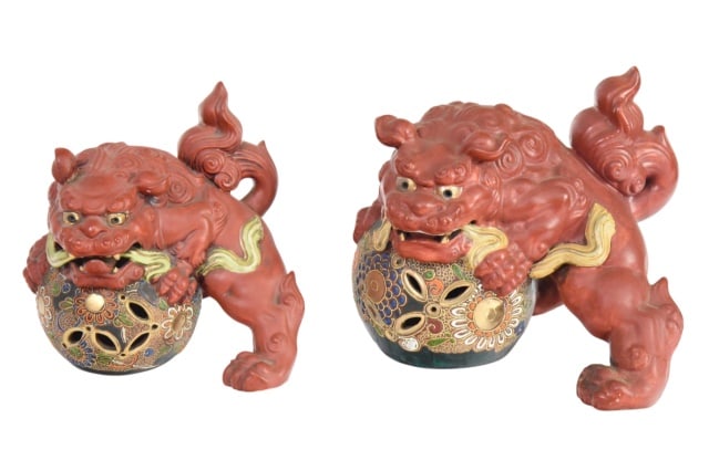 Two Vintage Japanese Kutani Shi Shi Figurines: Two Vintage Japanese Kutani Shi Shi (Gurdian Lion) Ceramic Figurines with it's Paw Resting on a Decorated Brocade Balls.Largest measures 8 inches x 10 inches x 8 inches.Please note that the smaller