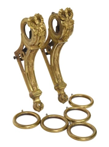 French Empire Ormolu Bronze Curtain Pole Holder: Antique French Empire Ormolu Bronze Curtain Pole Holder with Matching Rings. Ornate and Ribbon Motif.Curtain brackets measure 12 inches x 8 inches x 2 inches.Curtain rings measure 3.5 inches in
