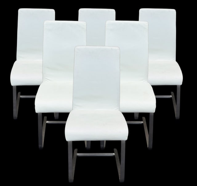 6 Modern Stainless Steal Leather Chairs: 6 Modern Stainless Steal Leather Upholstered Chairs Measures 38 inches x 18 inches x 20 inches x 19 inches. No rips or tears but need to be cleaned. Sold as is.