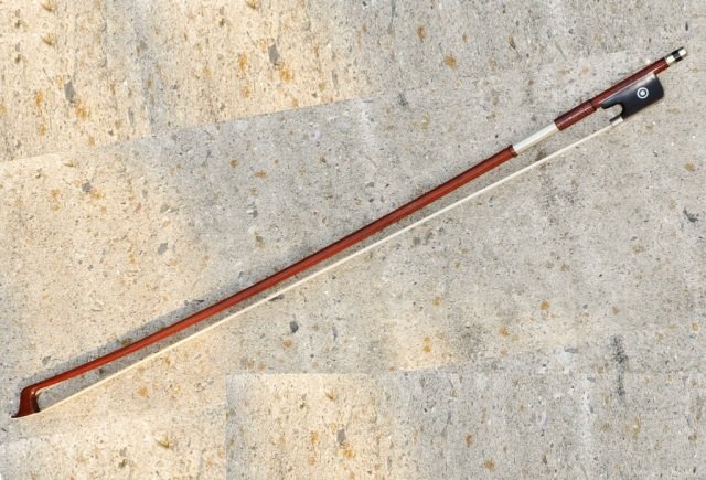 Vintage H. R. Fretzscher Cello Bow: Vintage H. R. Fretzscher full-size Pernambucco cello bow, 20th century. Silver winding and lizard grip, very good condition.