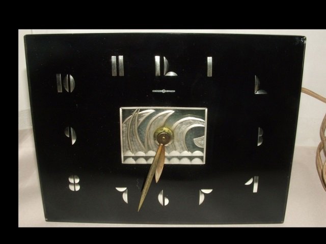 Art Deco General Electric Wall Clock: Art Deco General Electric wall clock. 5 3/4" H x 7 1/2" W x 2 3/4" D, very good vintage condition. Hour hand needs to be tightened to keep movement accurate, minute hand runs perfectly.