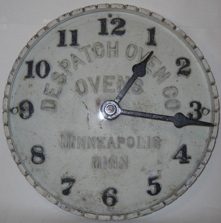 Vintage Despatch Oven Co. Metal Wall Clock: Vintage Despatch Oven Co. metal wall clock. 11 1/2" diameter, good used condition with typical usage wear/discoloration.