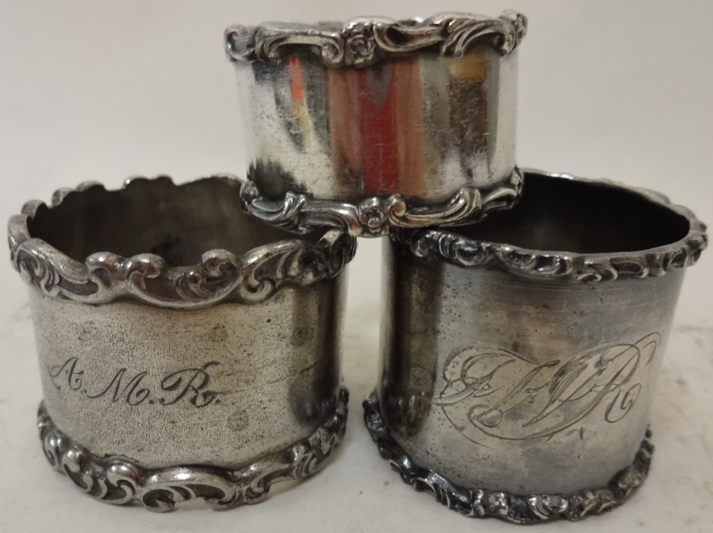 3 Vintage Sterling Napkin Rings: Three vintage sterling napkin rings. 1 7/8" diameter x 1 3/8" W and 1 5/8" diameter x 1" W.