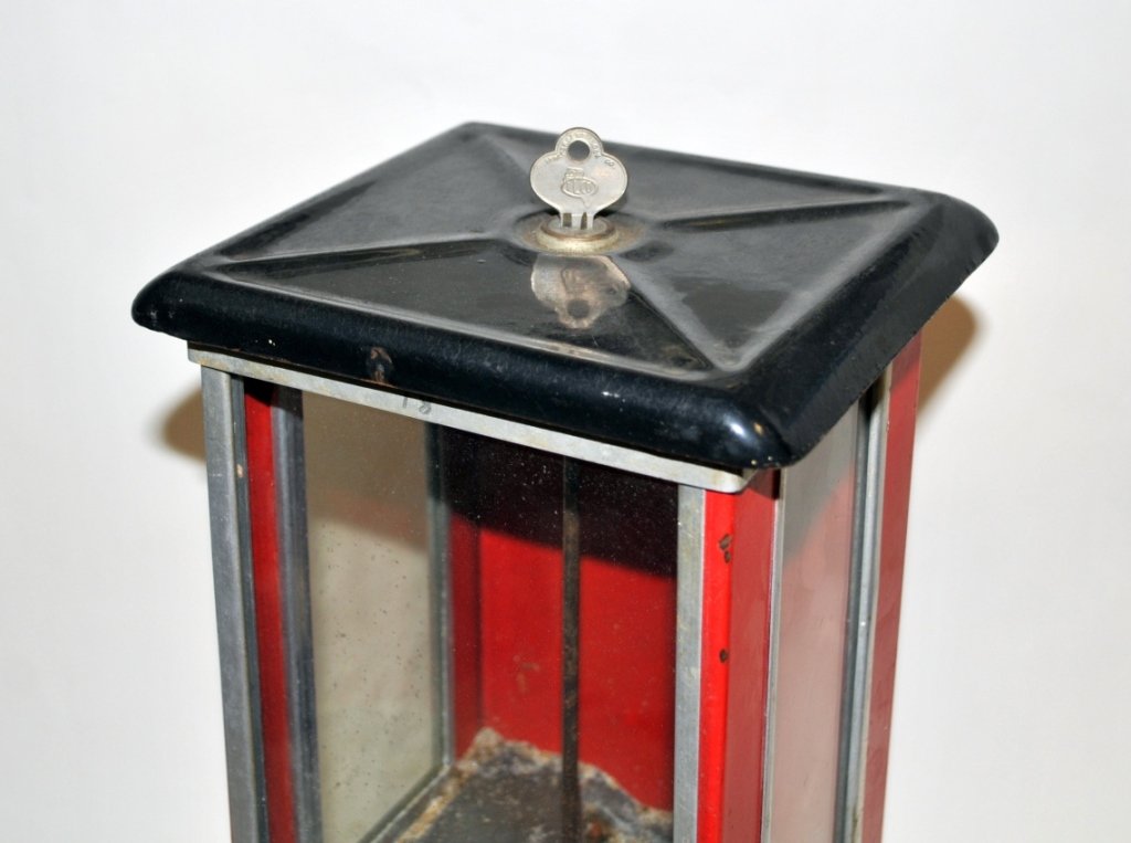 Antique Gumball & Vintage Stamp Machines: Pair of vending collectibles. Antique gumball machine, "Pat. Aug. 14- '23", "The Master", 1 cent (includes key), 8" L x 8" W x 16" H. Vintage stamp machine (no key), 10 1/2" L x 9" W x 13" H. Both in