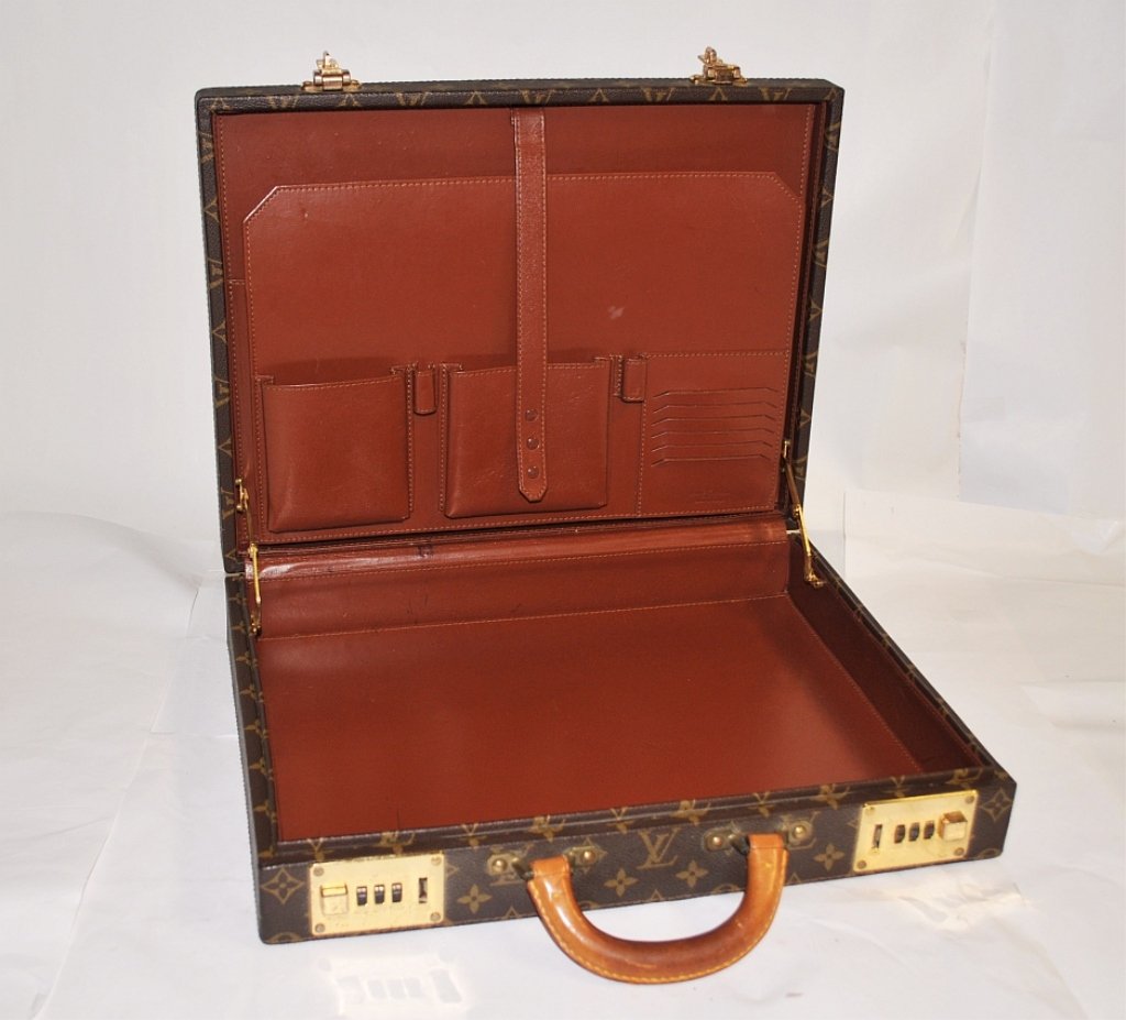 Vintage Louis Vuitton Hard-Case Leather Valise: Louis Vuitton handled hard-case leather trim valise. 16 1/2" L x 13" W x 3 1/2" D, excellent vintage condition. From a Greenwich collector.
