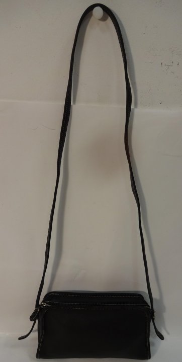 Black Coach Glove-Tanned Leather Purse: Black Coach glove-tanned leather purse. 9 3/4" W x 3 1/4" D x 5 1/2" H, very good condition.