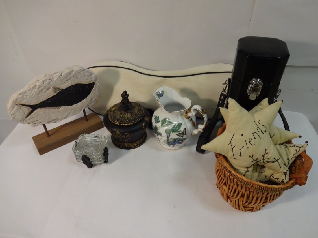 Lot of 14 Assorted Decorative Items: Lot of 14 assorted decorative items. Badminton set with bag, black vinyl wine carrier, black and gold urn with lid, three decorative star pillows, one small pillow with horse motif, one fish fossil, o
